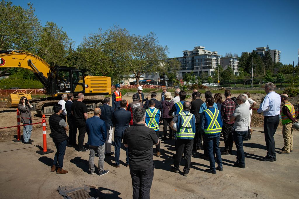 Gathering for ground-breaking celebration at Menno Hall construction site